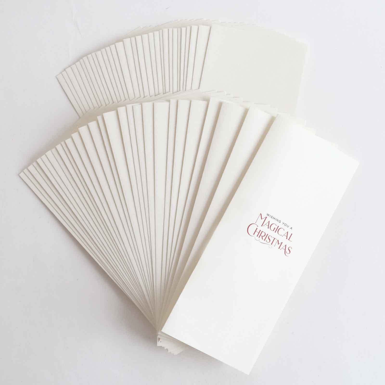 a bunch of white cards sitting on top of a table.