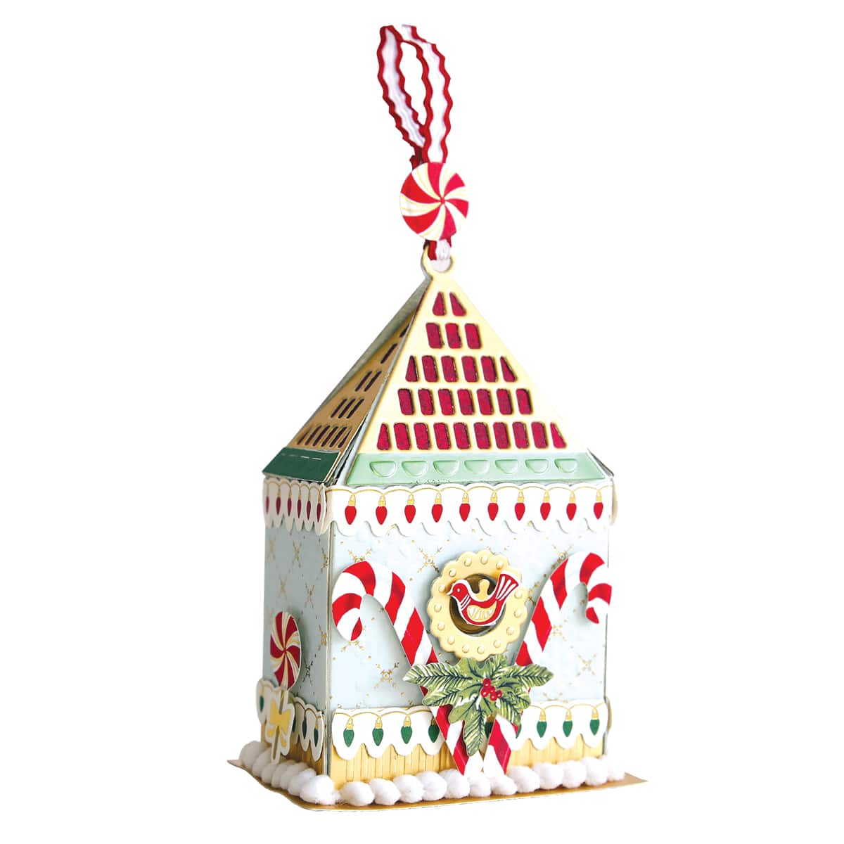 a small white building with candy canes hanging from it's roof.