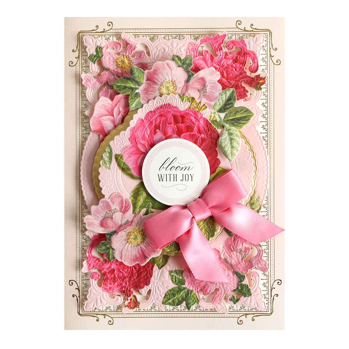 a card with pink flowers and a ribbon.