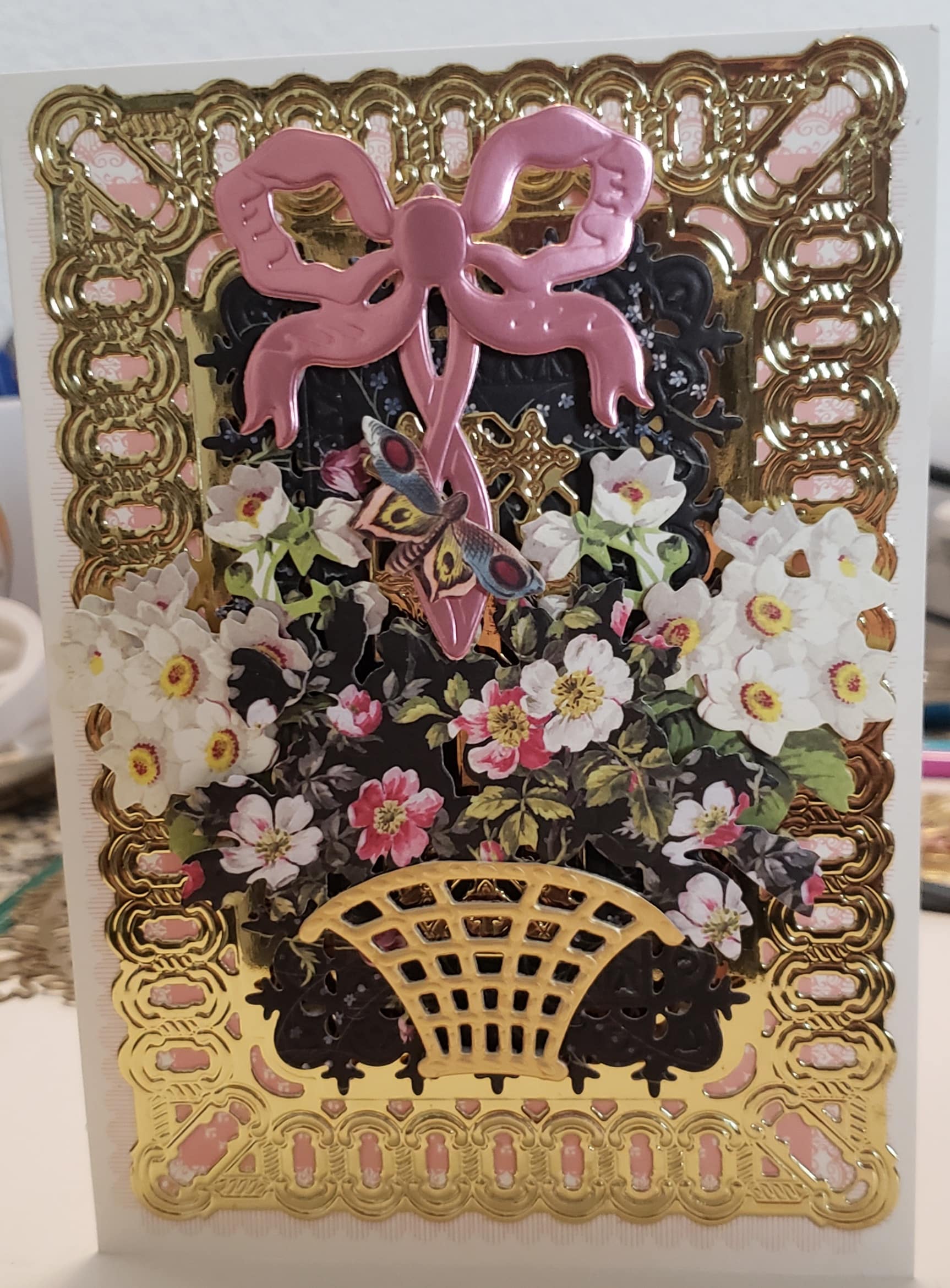 a greeting card with flowers and scissors on it.