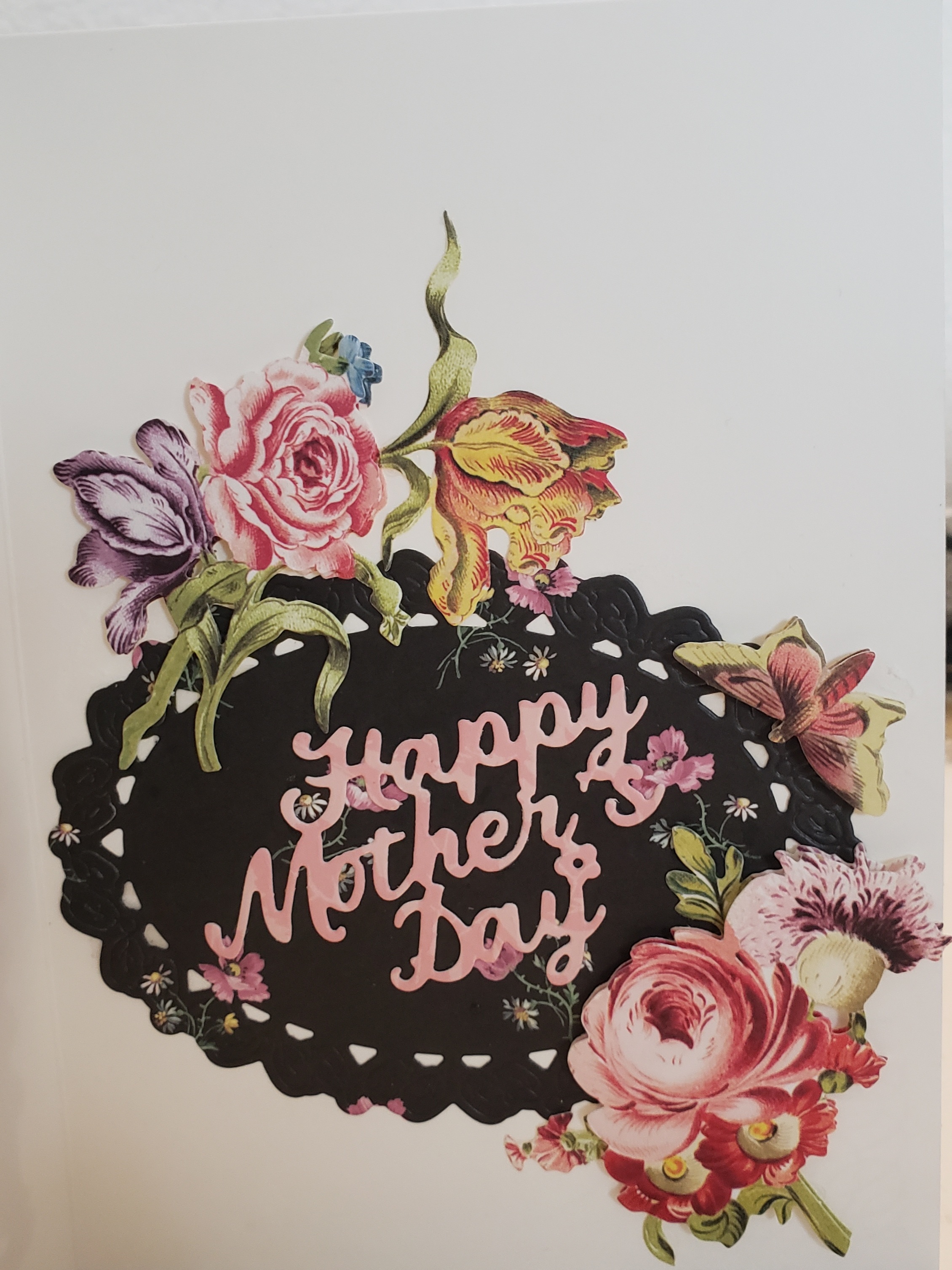 a mother's day card with flowers on it.