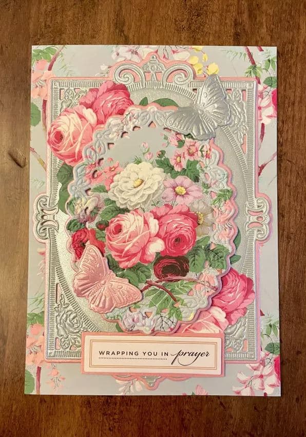 a card with a bouquet of flowers on it.