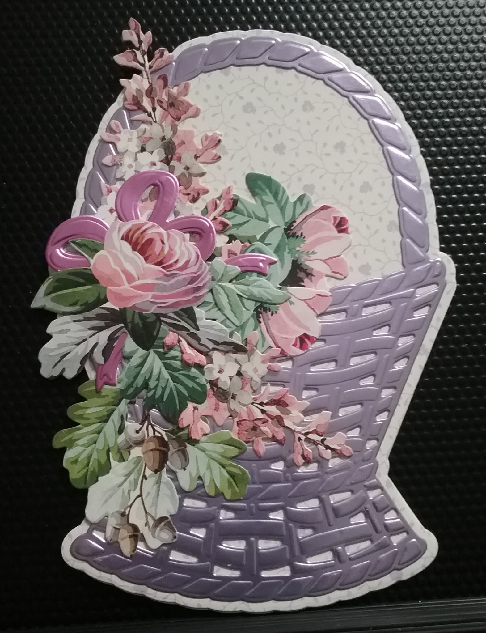 a picture of a basket with flowers on it.