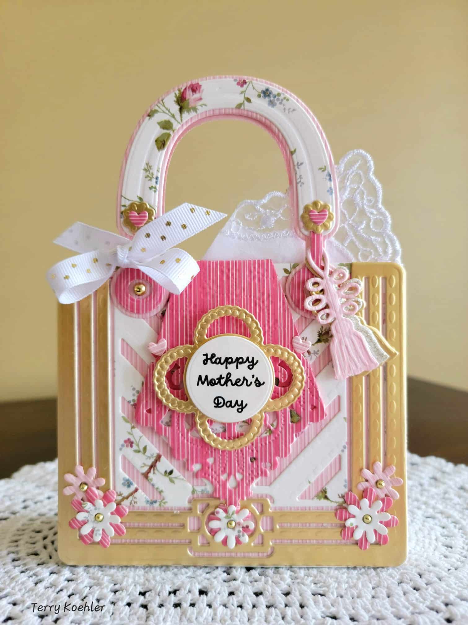 a pink and white bag with a happy mother's day tag on it.