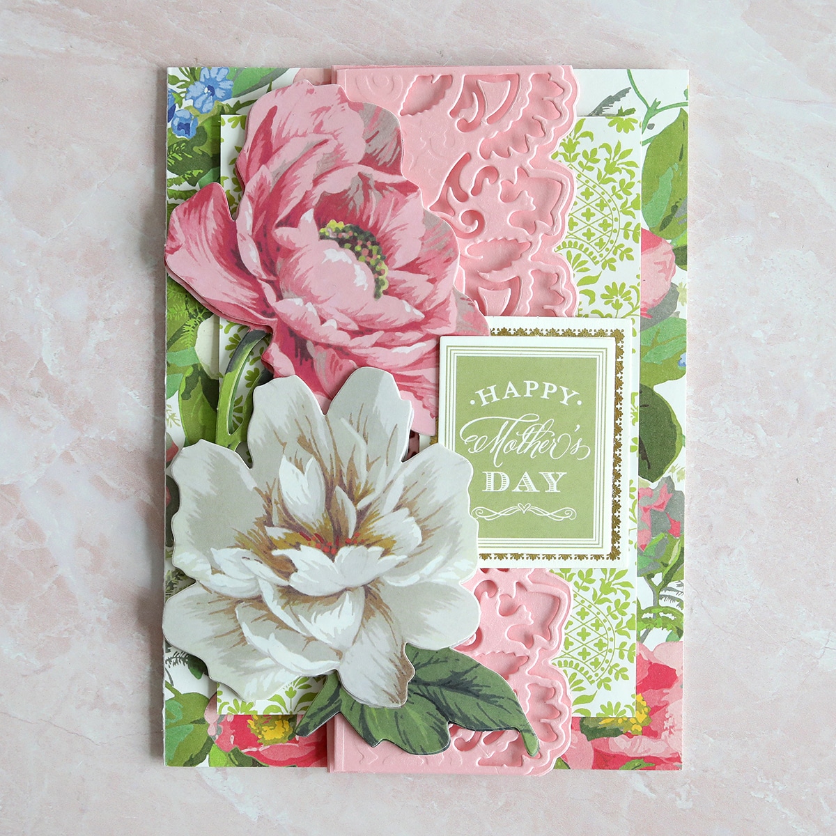 a card with flowers on it and a happy mother's day card.