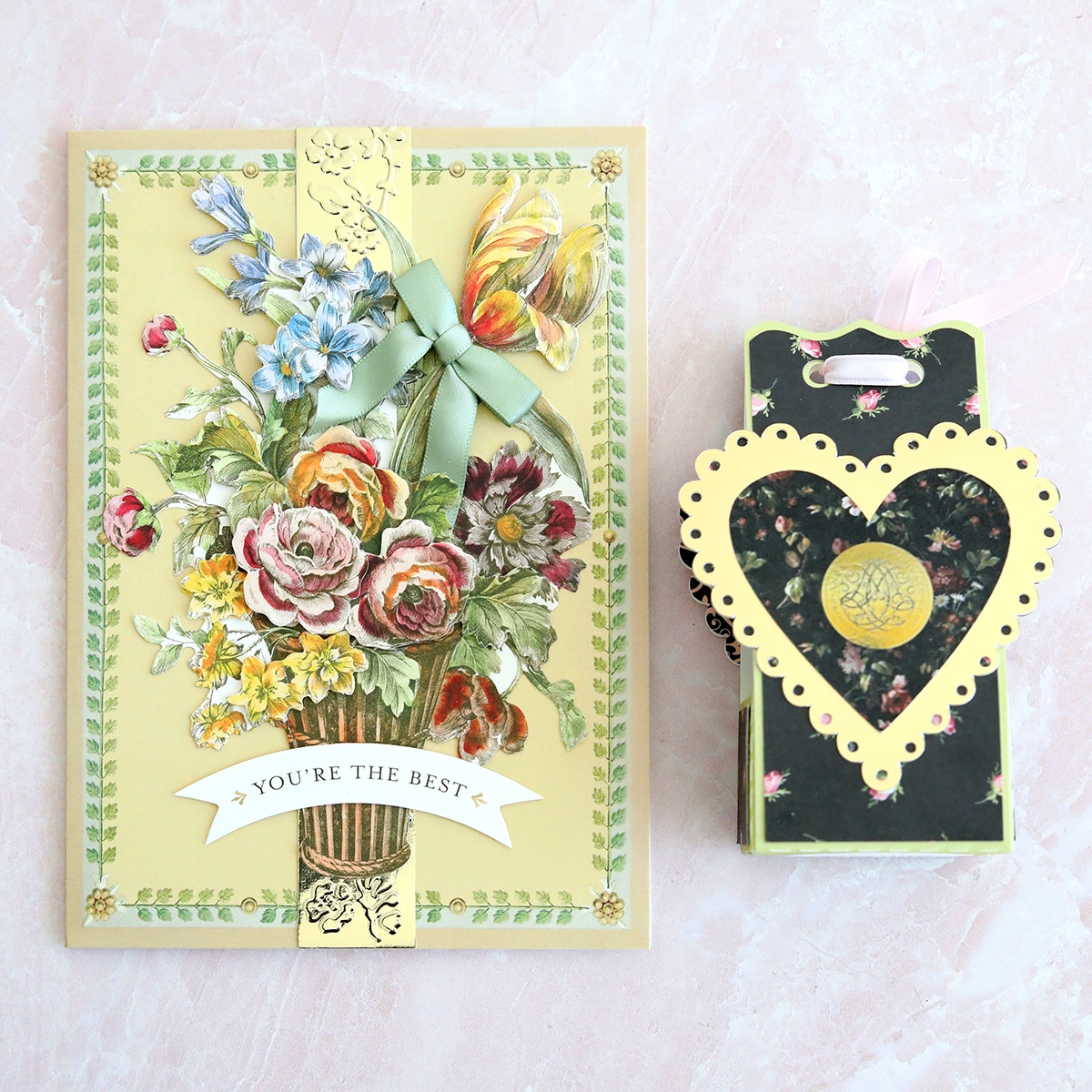 a card and a box with a flower bouquet on it.