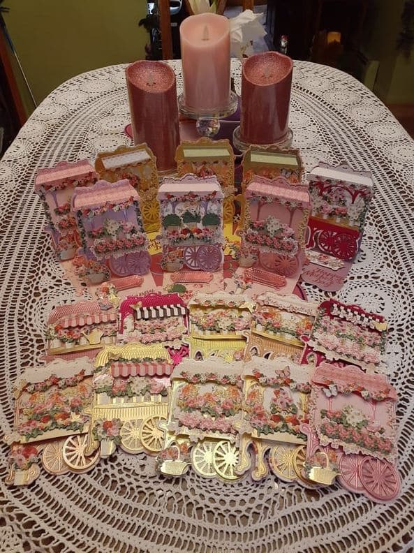 a table topped with lots of pink and gold items.