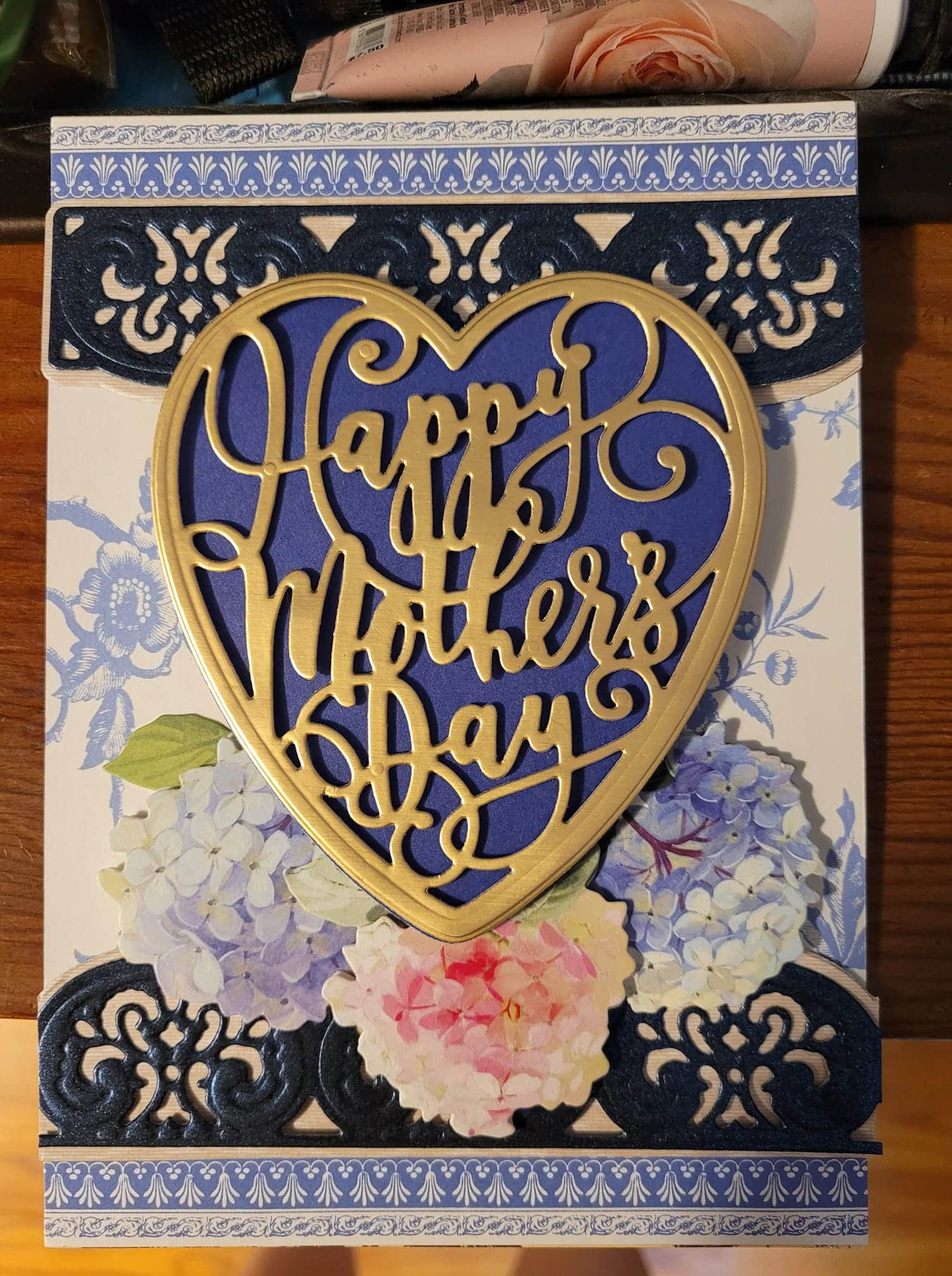 a card with a heart shaped cutout that says happy mother's day.
