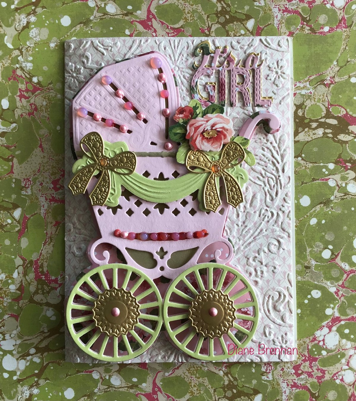 a close up of a card with a baby carriage.