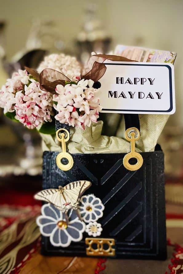 a close up of a vase of flowers on a table.