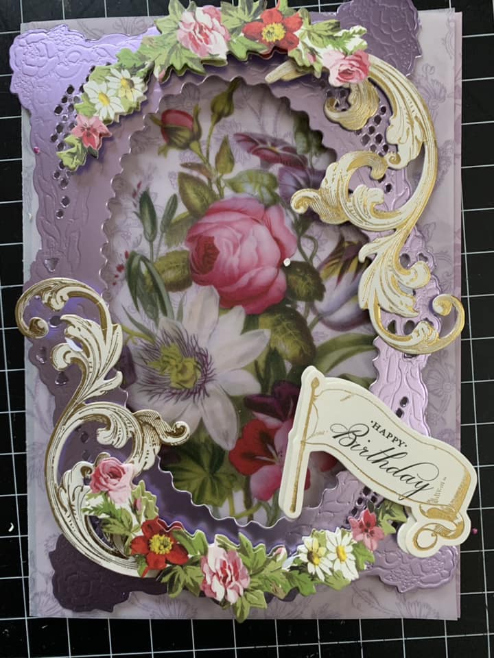 a close up of a card with flowers on it.