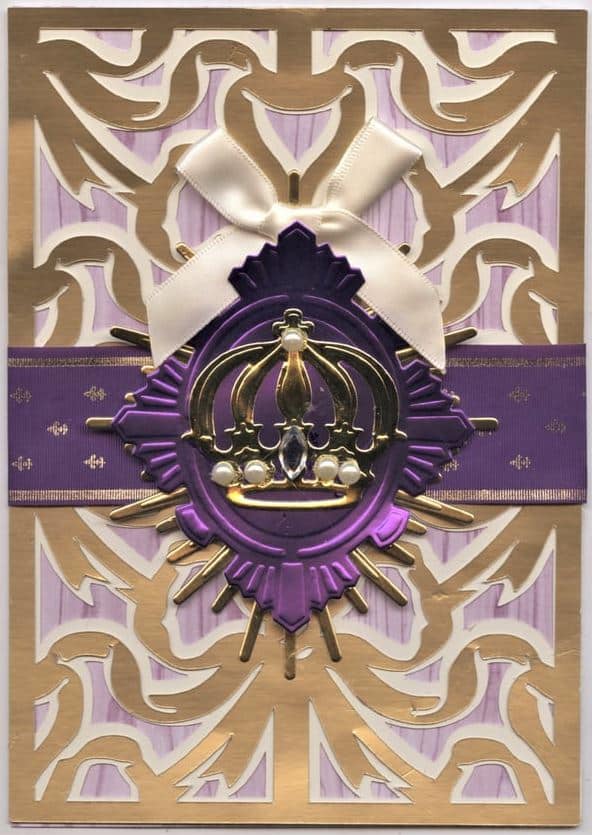 a purple and gold card with a crown on it.