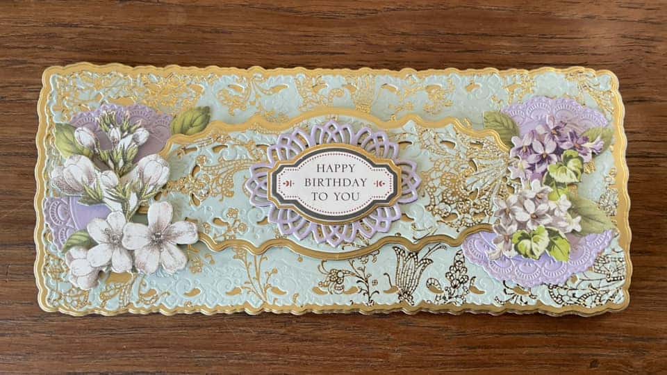 a close up of a card with flowers on it.