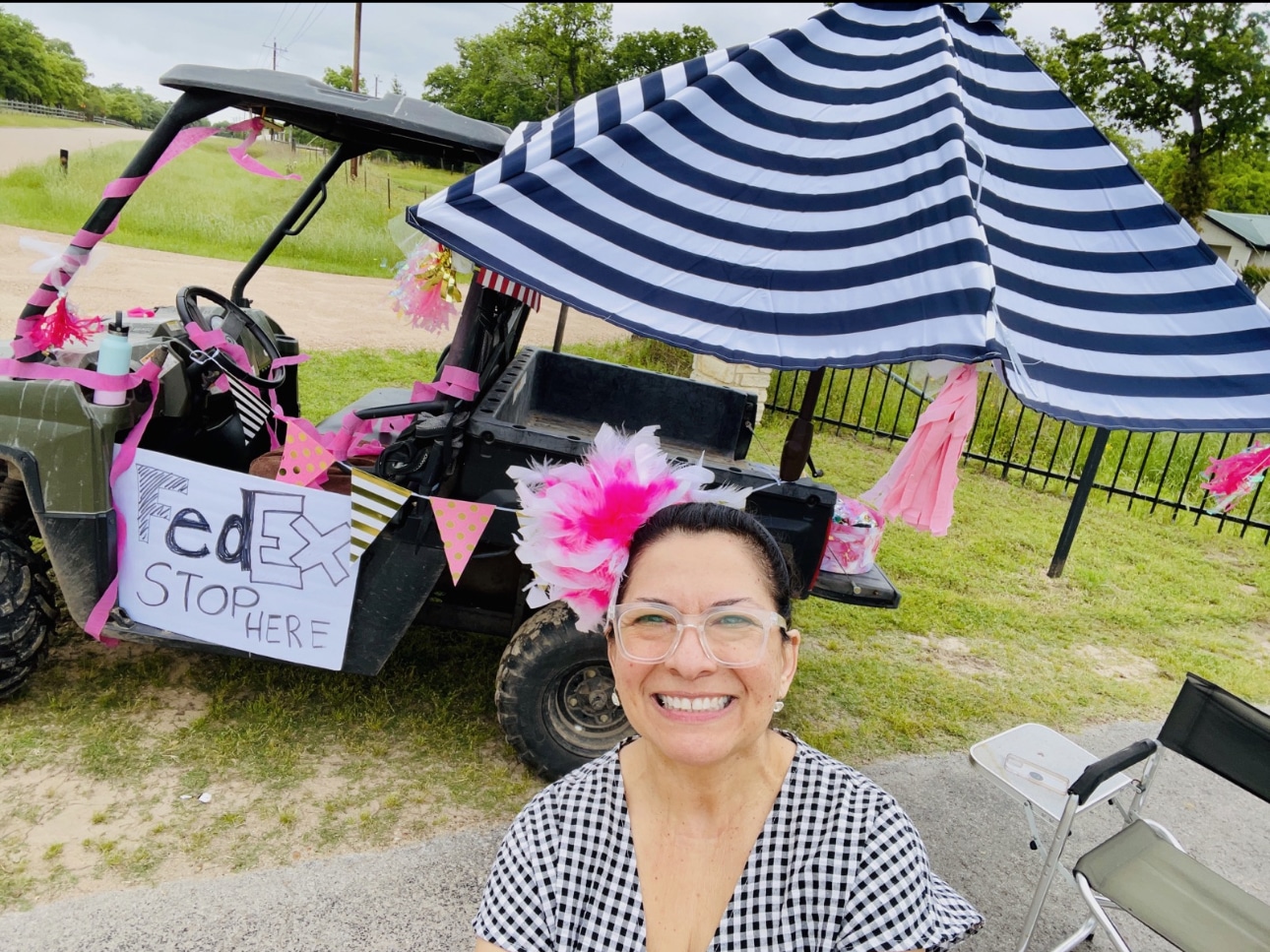 a woman sitting in front of a golf cart.