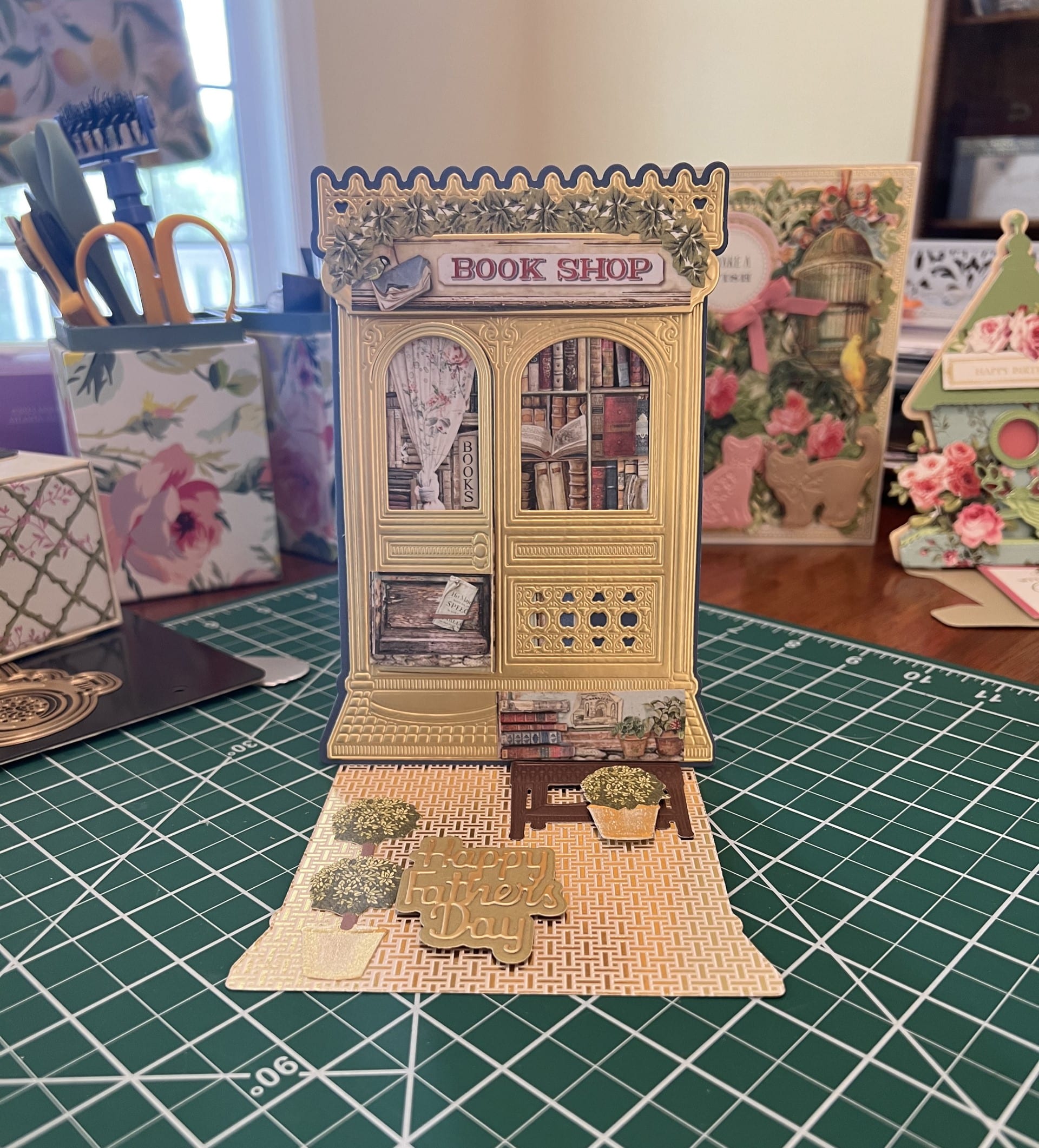 a miniature book shop is on a table.