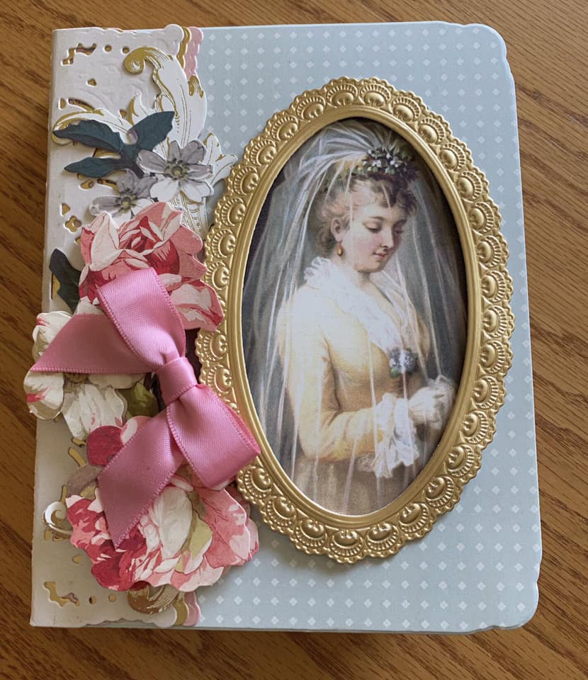 a wedding album with a picture of a bride.