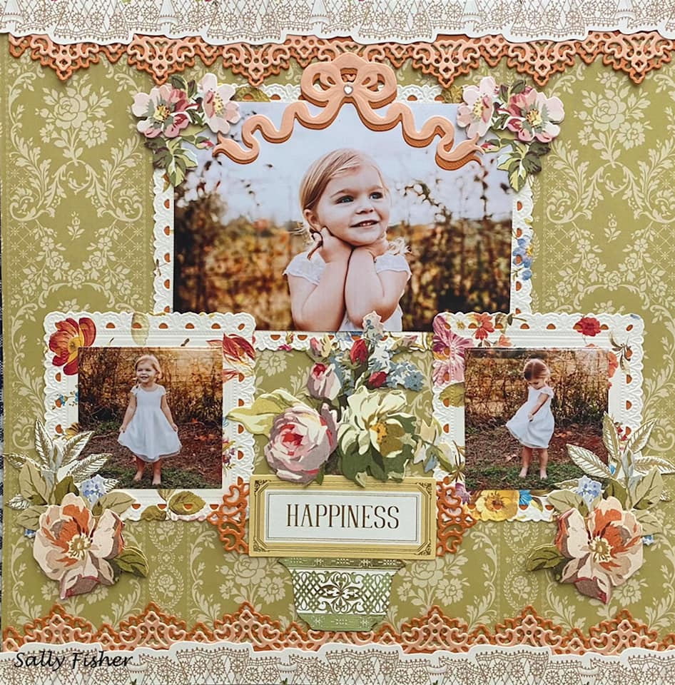 a scrapbook page with pictures of a little girl and flowers.