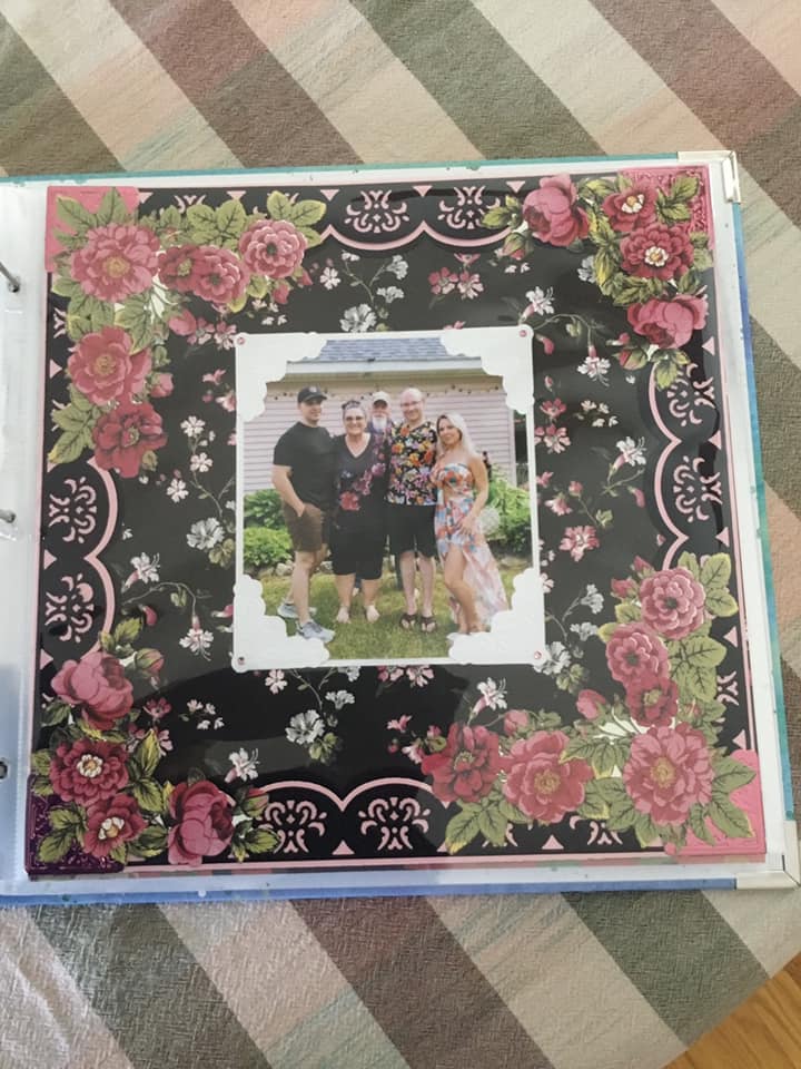 a photo album with a photo of a family on it.
