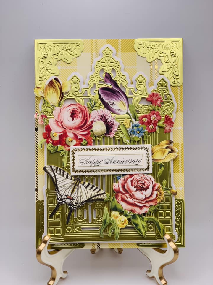 a card with flowers and a butterfly on it.