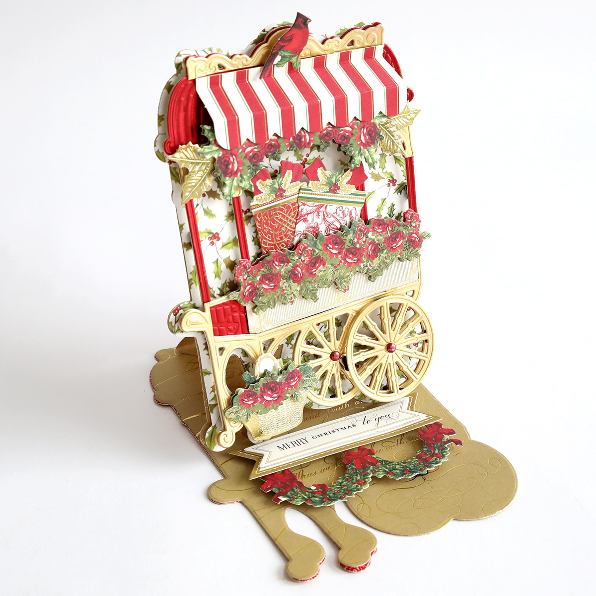 a decorative cart with flowers and a red and white striped awning.