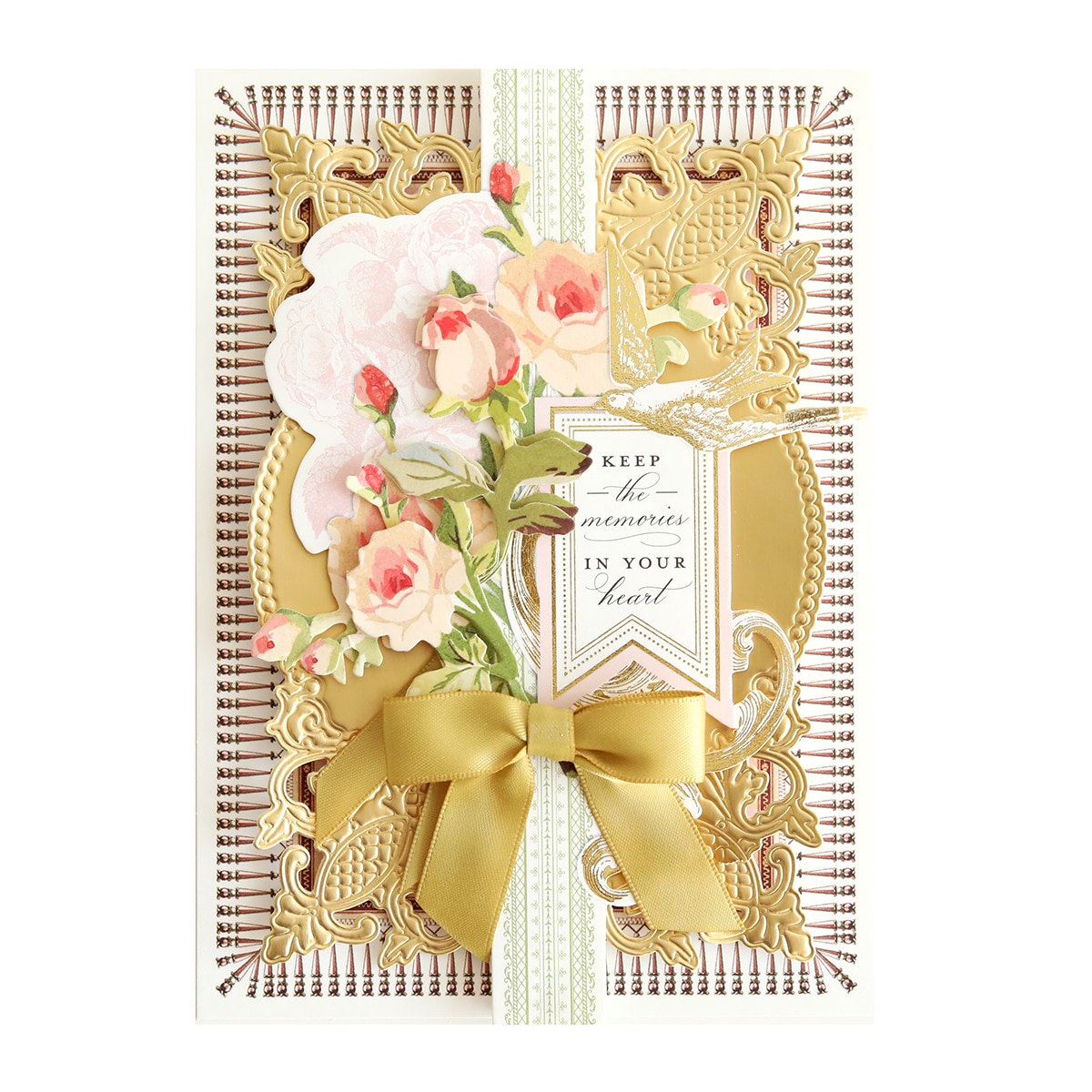 a gold card with flowers and ribbon.