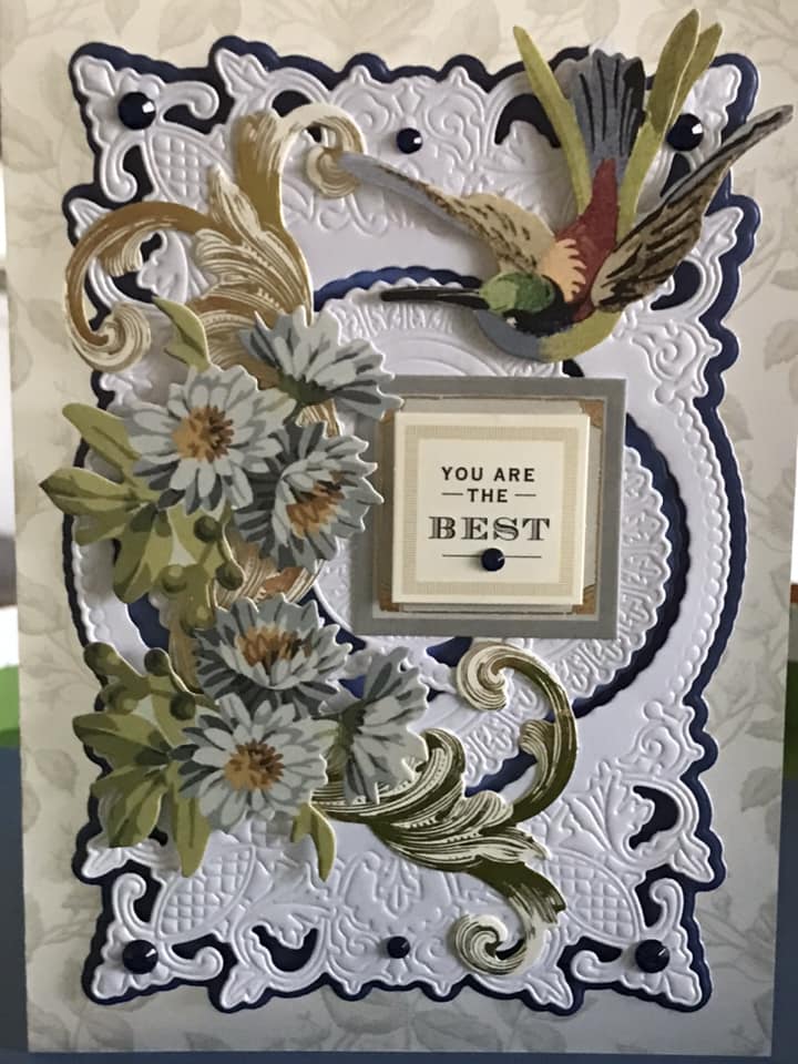 A card with a hummingbird and flowers.
