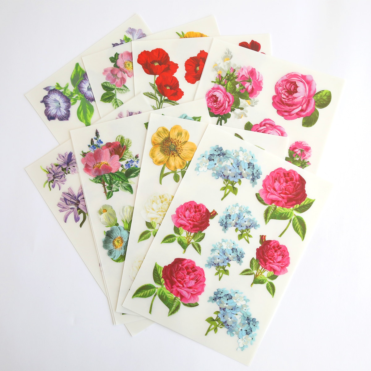 A bunch of Celebrations Floral 3D Stickers and Rub Ons on a white surface.