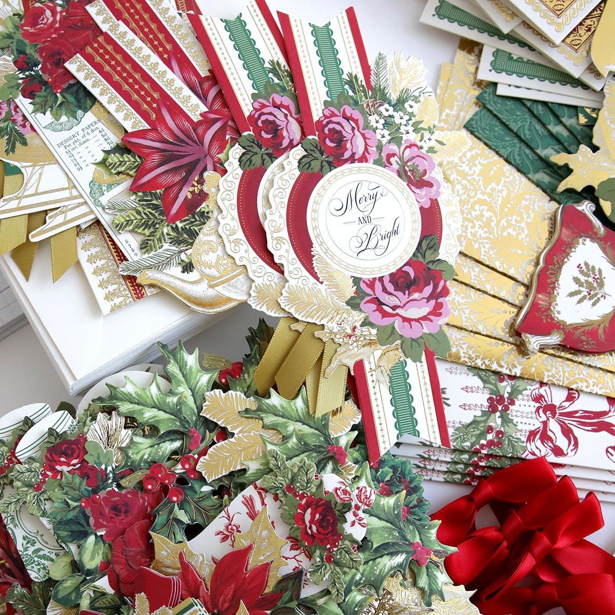 a collection of christmas cards with ribbons and bows.