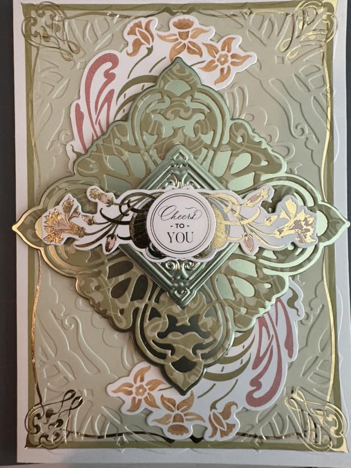 A card with gold and silver designs.