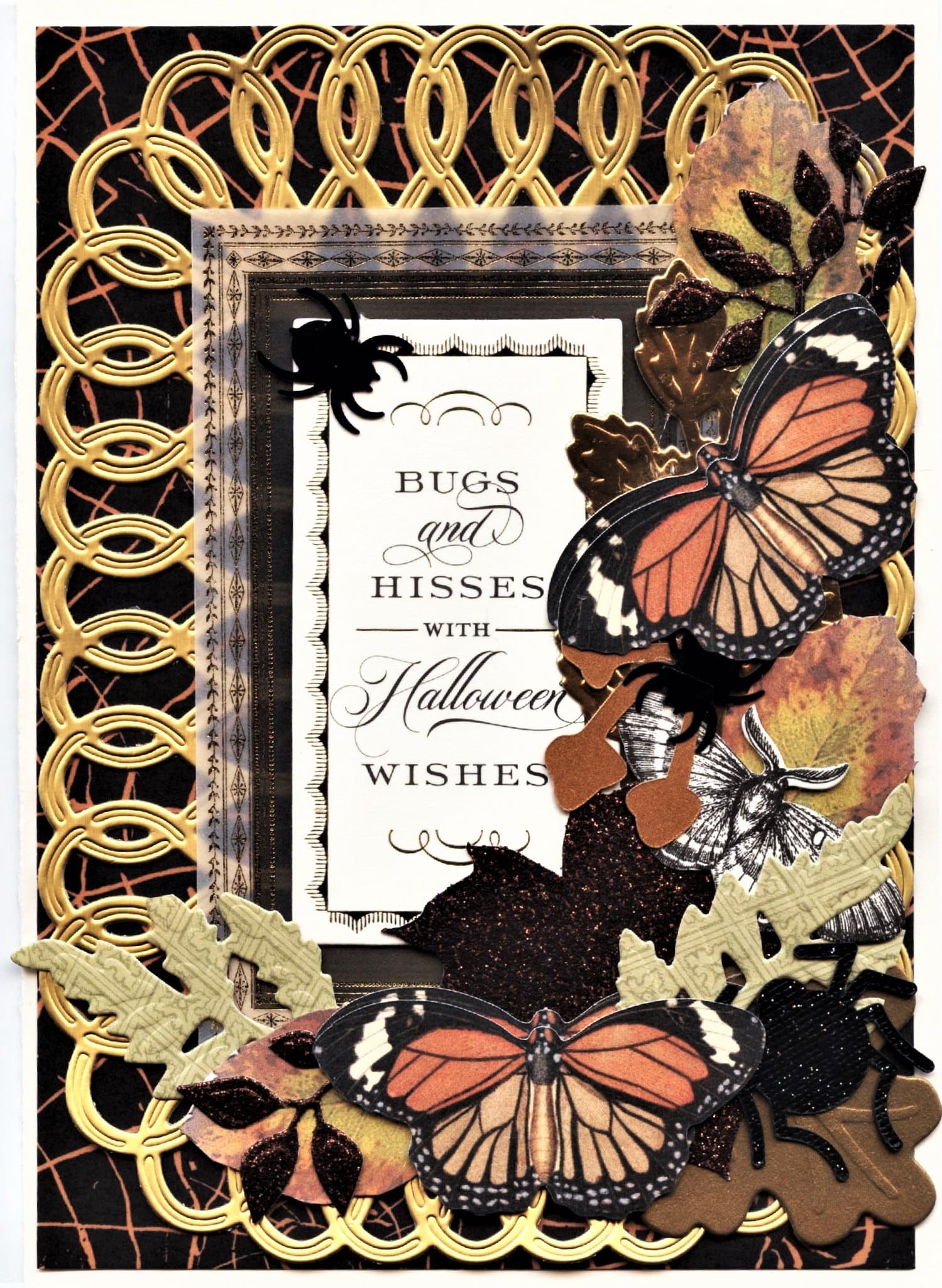 A black and gold frame with butterflies and leaves.