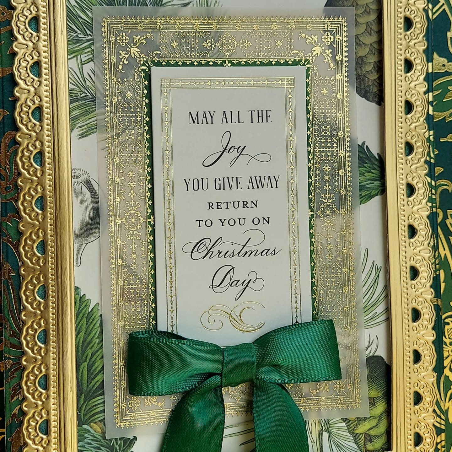 A green frame with a green bow and a green ribbon.