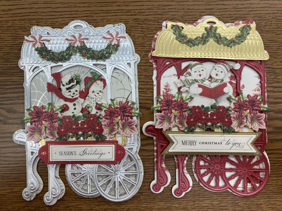 Two christmas cards with santa and reindeer on them.
