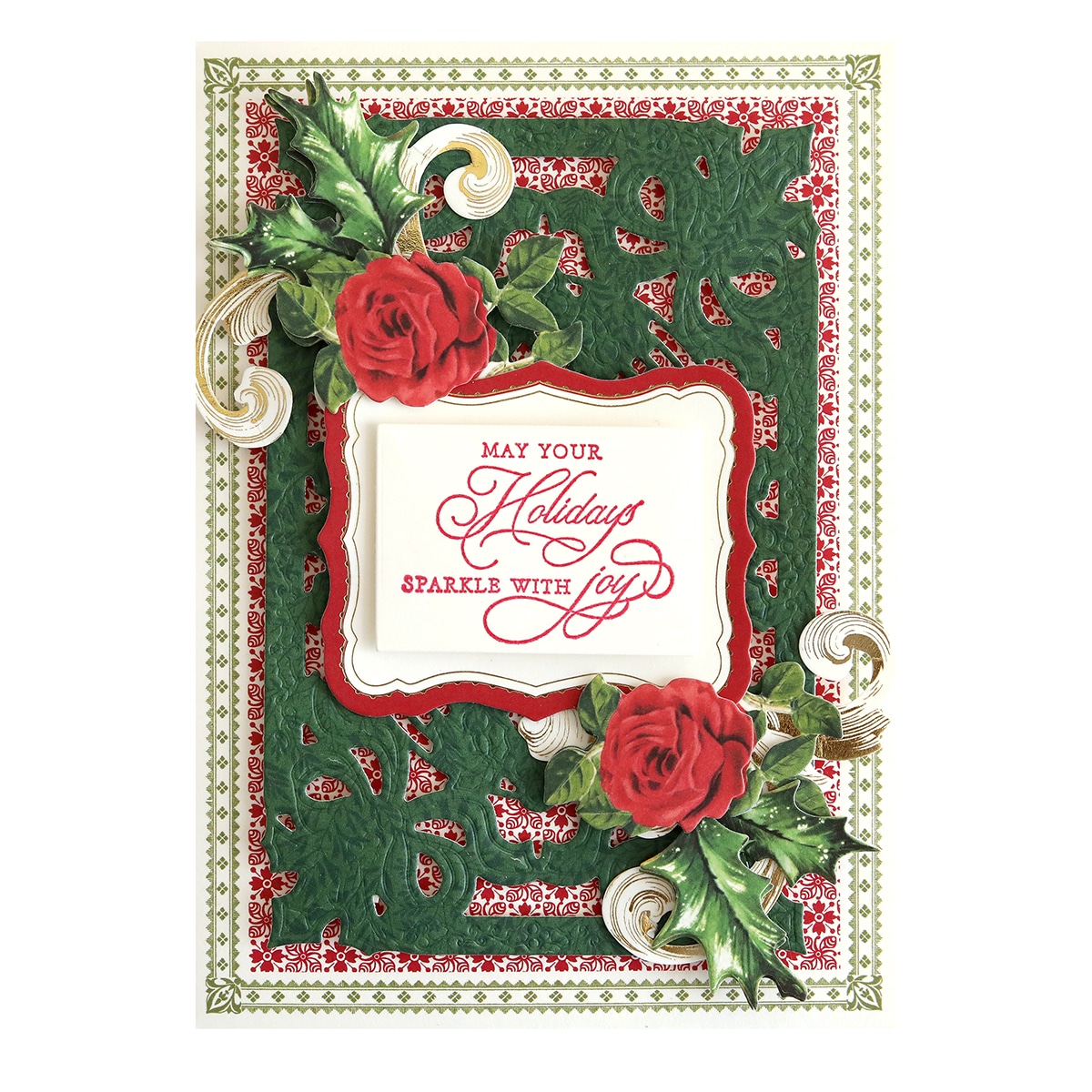 A christmas card with roses and holly.