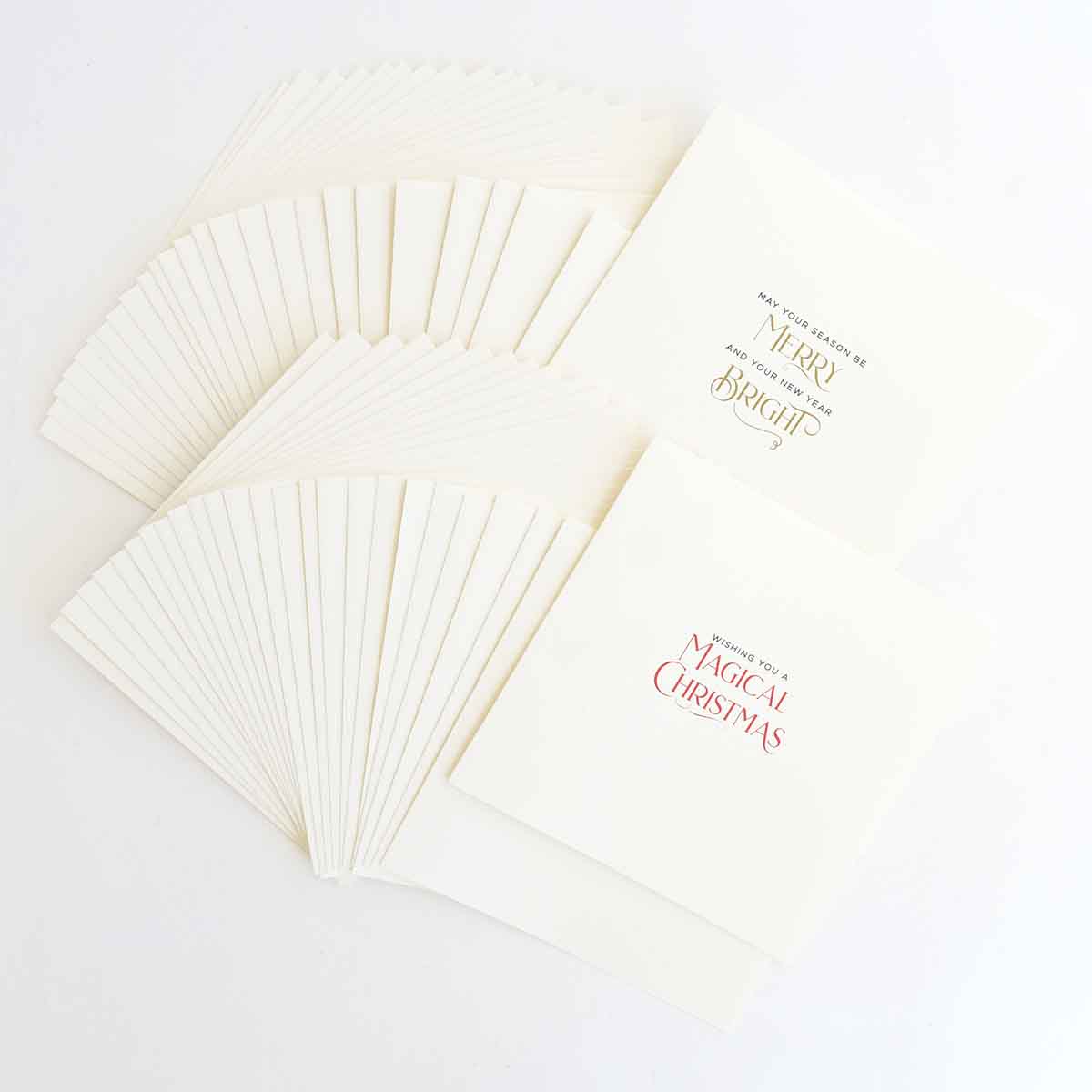 A stack of white cards with the words merry christmas.