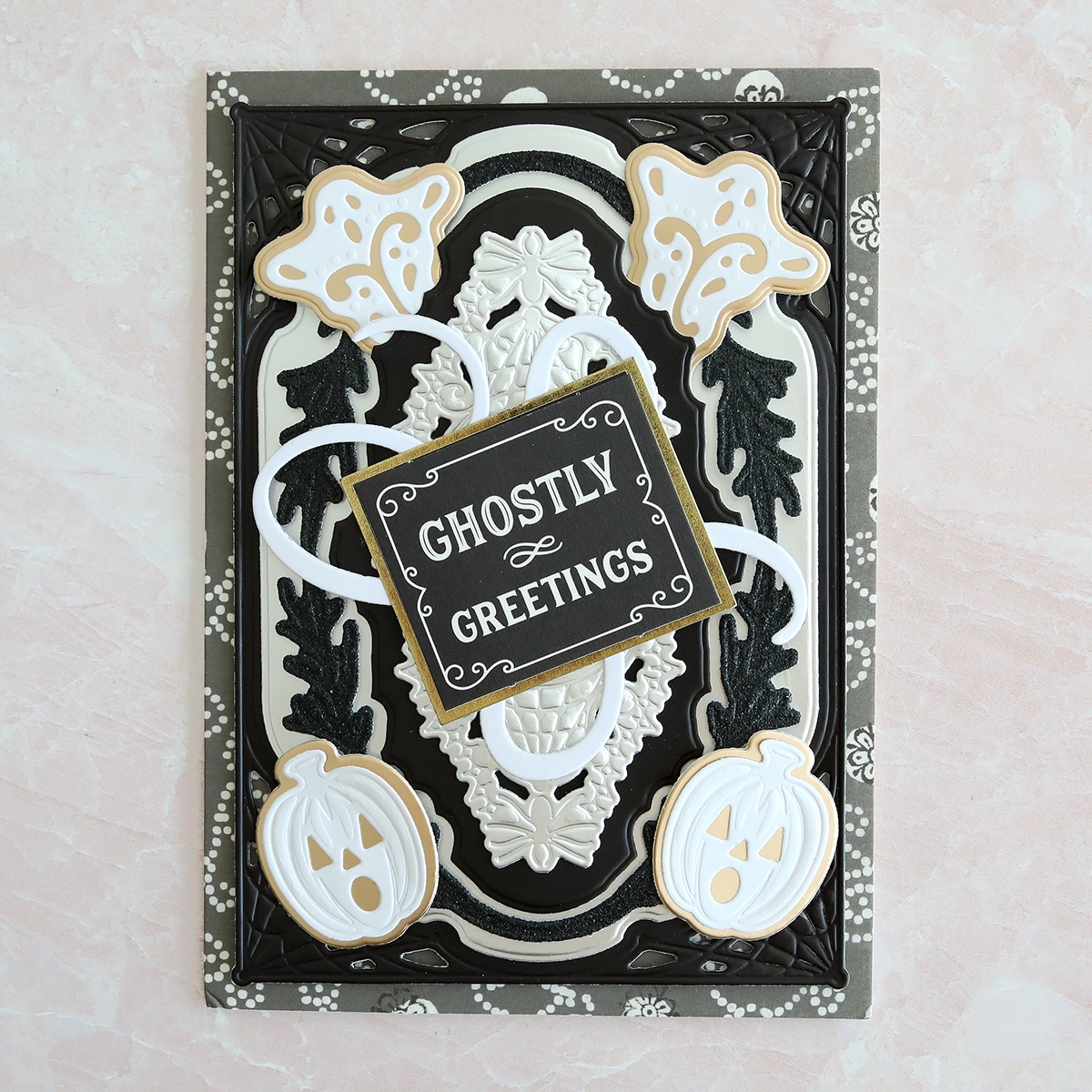 A black and white card with ghostly greetings on it.