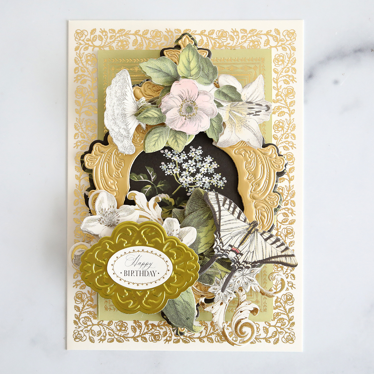 A card with flowers and butterflies on it.