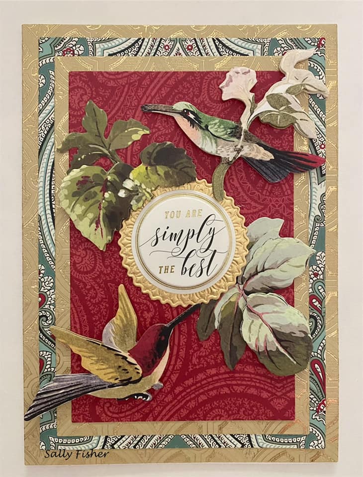 A card with hummingbirds and leaves on it.