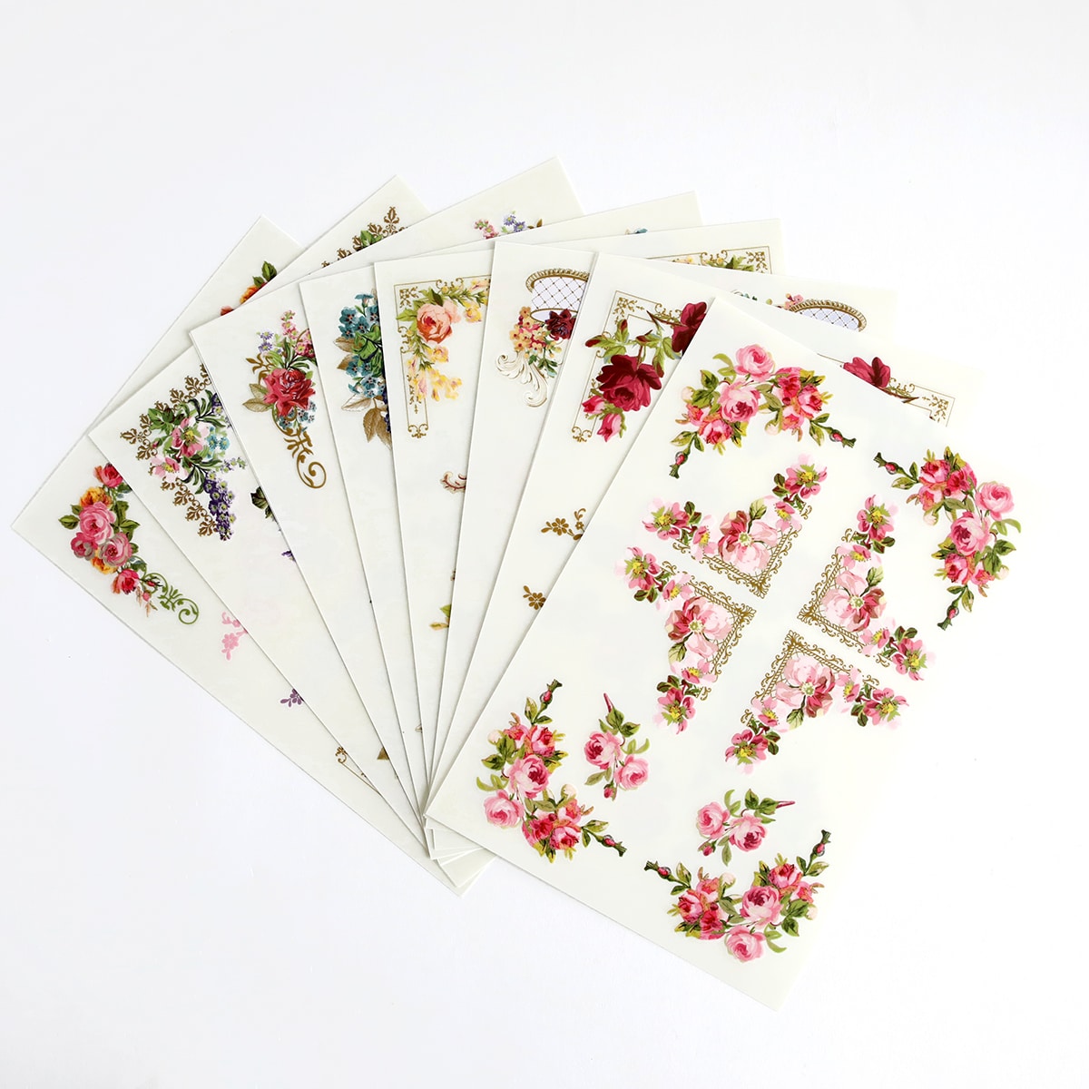 A set of flower shaped stickers on a white surface.