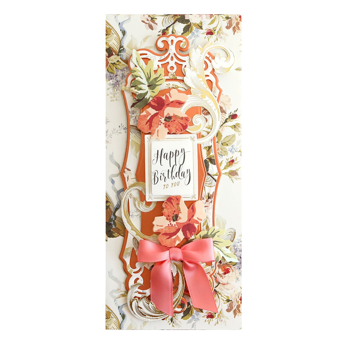 A happy birthday card with a bow and flowers.