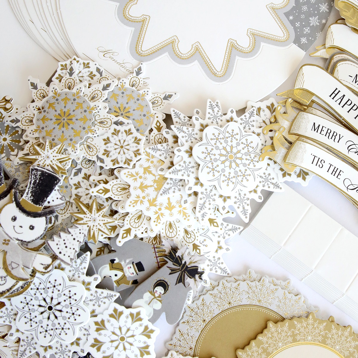 A collection of gold and white snowflakes.