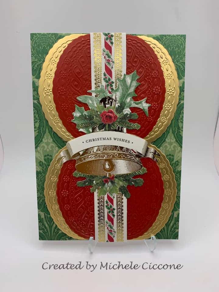 A christmas card with gold and red ornaments.