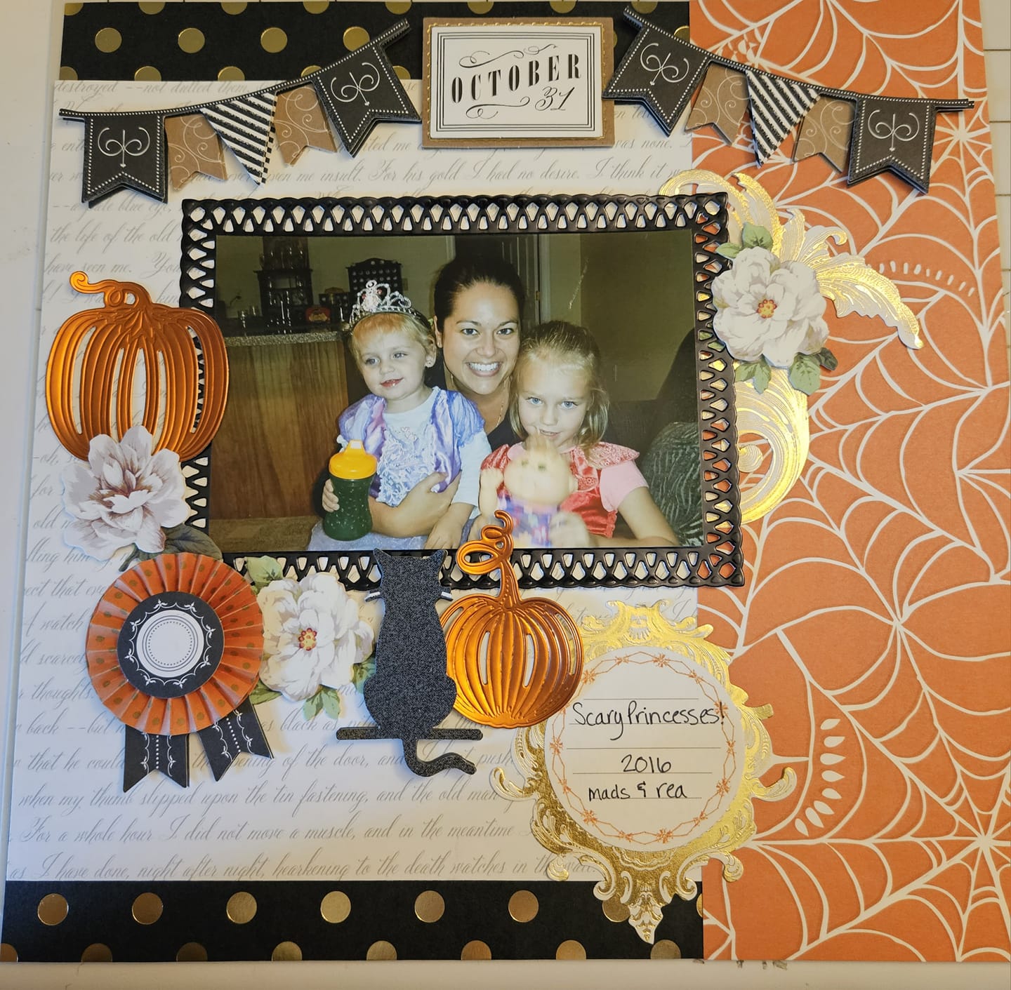 A scrapbook page with a photo of a family and pumpkins.