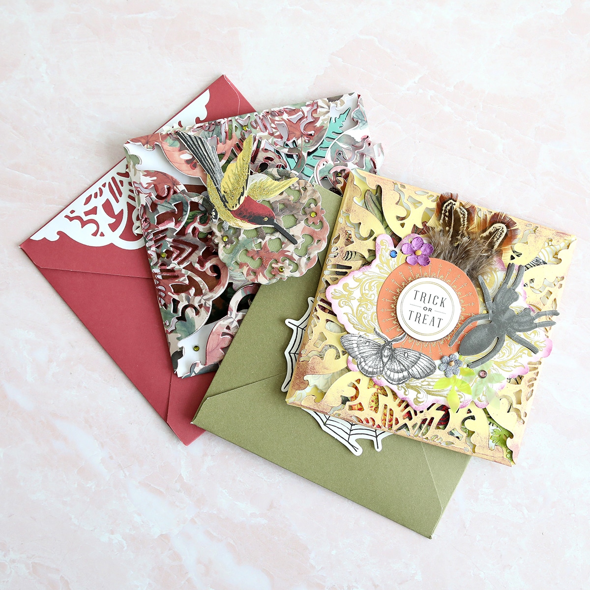 Three envelopes with different designs on them.