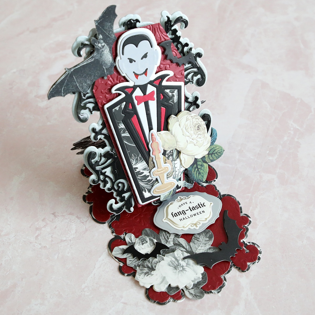 A pop up card with a dracula and bats.