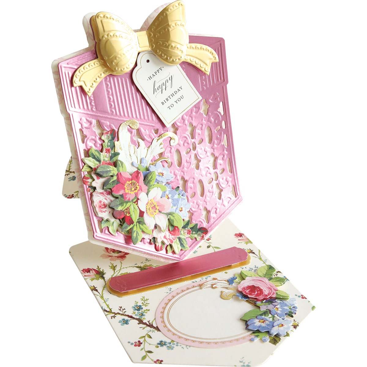 A pink card with a bow and flowers on it.