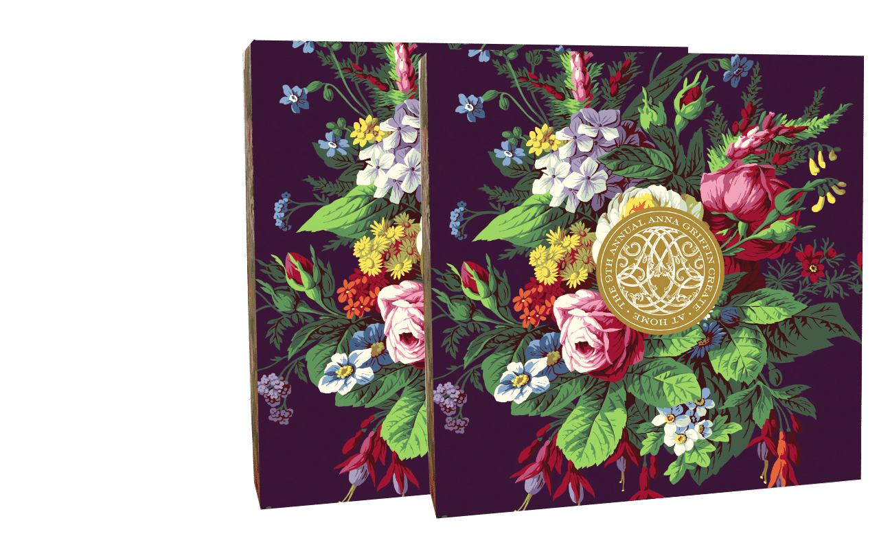 A set of two books with flowers on them.