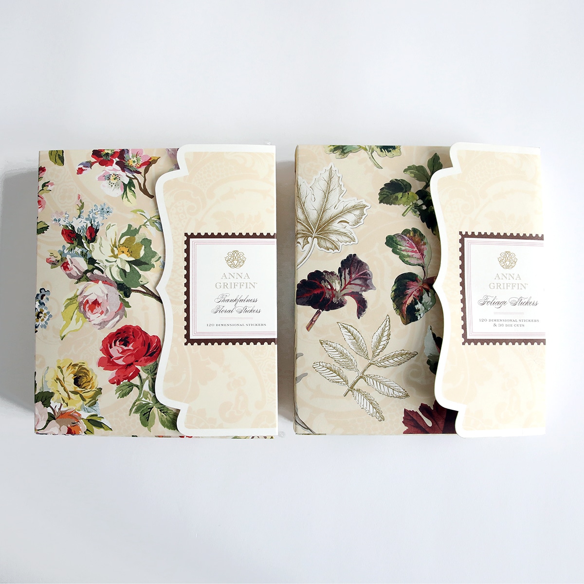 Two boxes with floral designs on them.