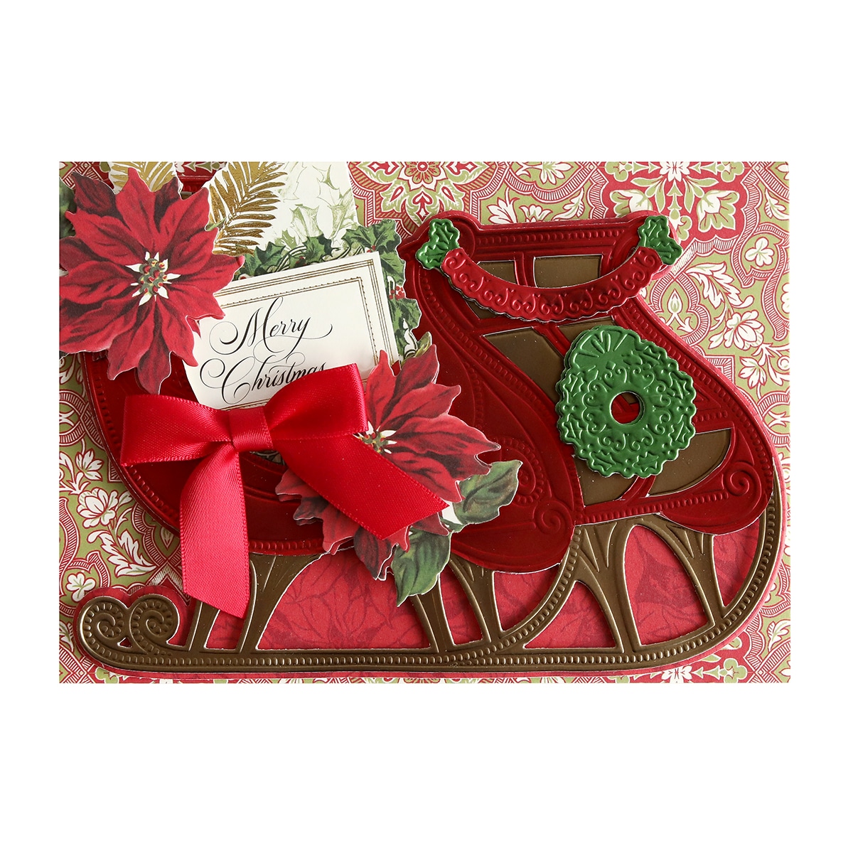 A christmas card with a sleigh and poinsettias.