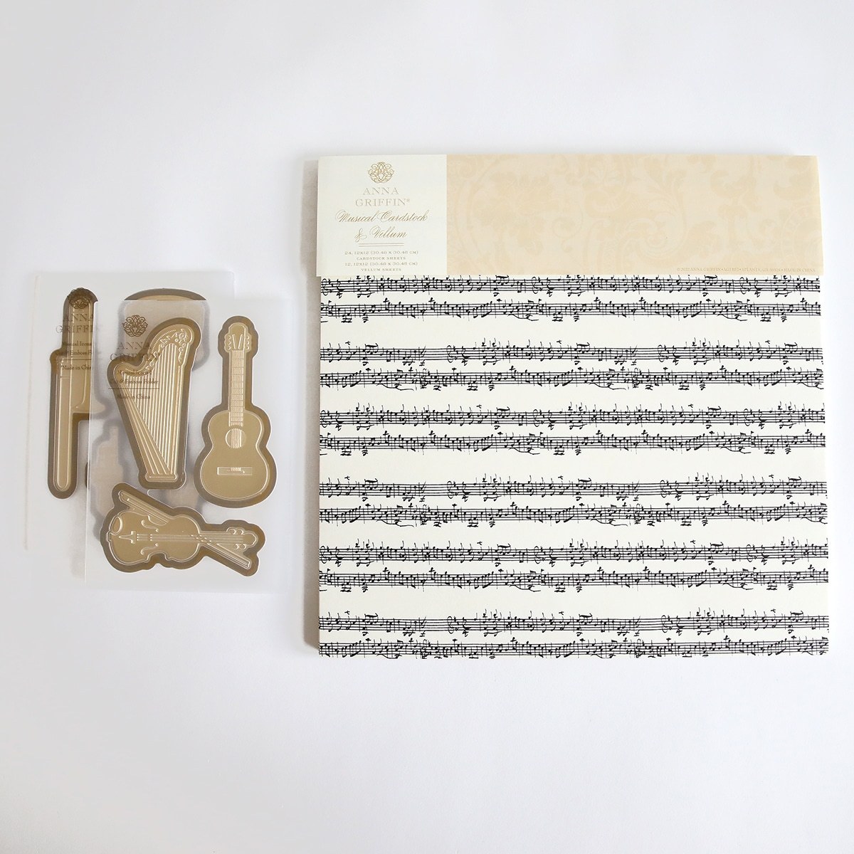 A set of musical note cookie cutters and a sheet of music.