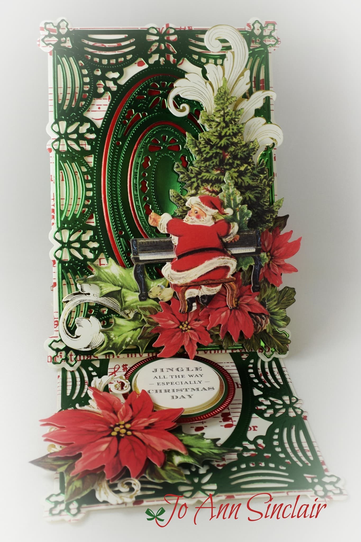 A christmas card with a santa claus sitting on a bench.